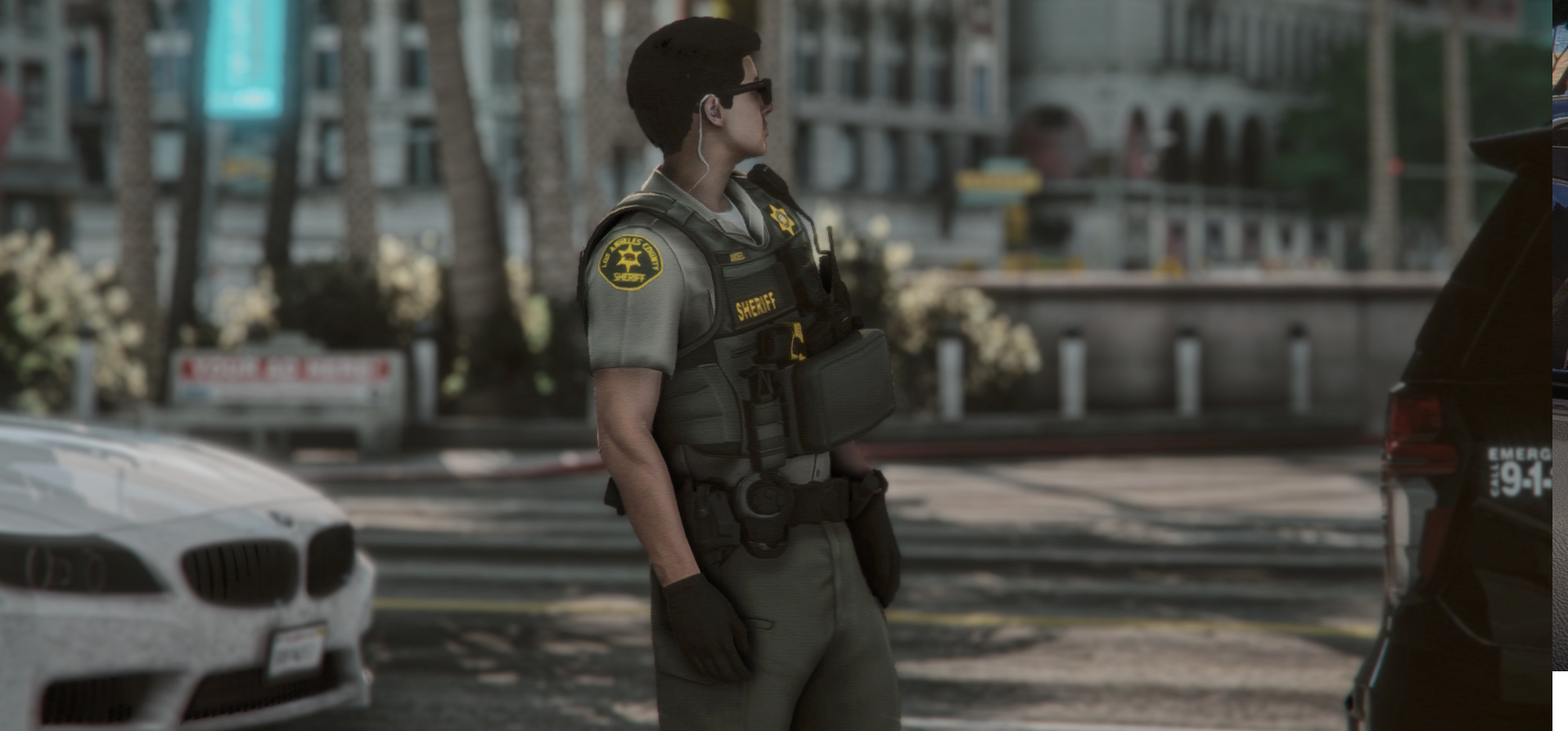 A Los Angeles County sheriff's deputy standing on patrol